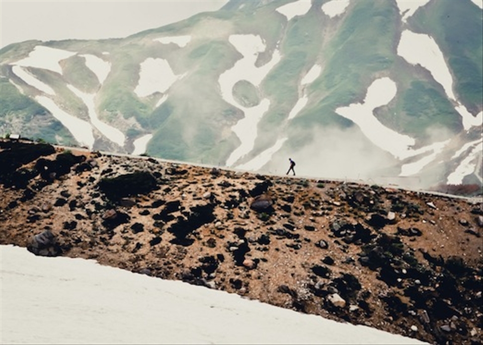 A lone hiker climbs Tateyama Rempo.