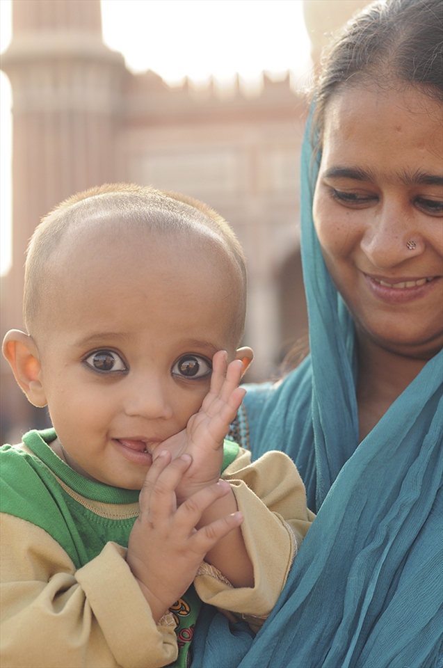 I was drawn to the eyes of the baby! His eyes were so expressive, innocent and excited. I took this photo with his mother in New Delhi.