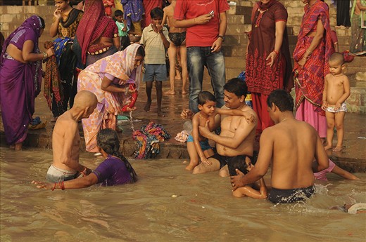 A tradition and faith that will truly never die. I like how this photo shows a ritual being performed by different generations of the family, child, adult, and grandparent. The Ganga ritual, submerging oneself on the water to purify one’s soul, is a family affair every morning in Varanasi. In this scene, the father at the middle of the frame is like introducing to his son their faith in submerging oneself in the river , the other father is also assisting his child, as well as the grandfather is also being assisted. I like how involved the people are with each other’s activities.