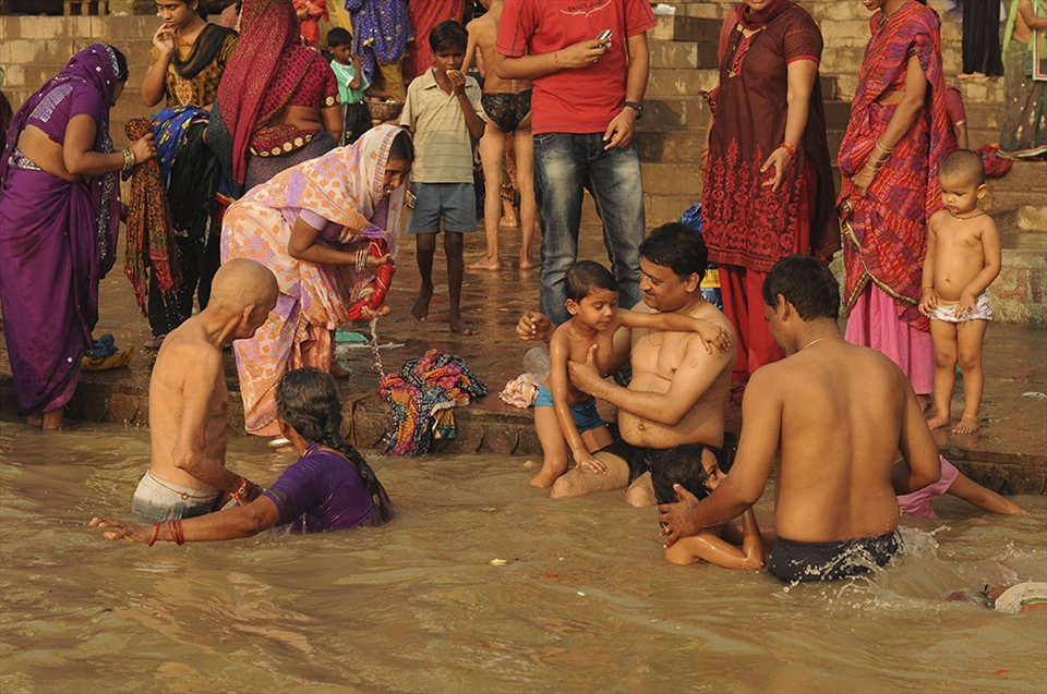A tradition and faith that will truly never die. I like how this photo shows a ritual being performed by different generations of the family, child, adult, and grandparent. The Ganga ritual, submerging oneself on the water to purify one’s soul, is a family affair every morning in Varanasi. In this scene, the father at the middle of the frame is like introducing to his son their faith in submerging oneself in the river , the other father is also assisting his child, as well as the grandfather is also being assisted. I like how involved the people are with each other’s activities.