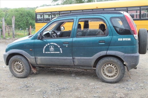 Work truck with family hanging out inside