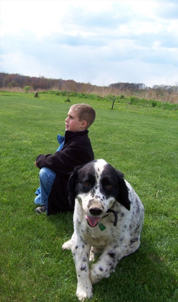 Nicholas, the eldest son in my host family, waited anxiously for his turn to bat in a mini baseball game with his cousins. Meanwhile, a sheep dog had enough of watching his human friend and decided to smell the photographer instead. West Sunbury, Pennsylvania, USA.