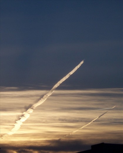 Transit at the final airport. Two jet fighters training had painted the sunset sky with adventure trails. On a personal level, it signifies the beginning of my own adventure and leap of faith. Washington D.C, USA. 