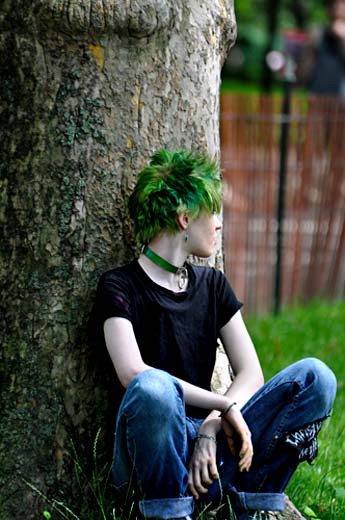   People are fascinating animals. A girl watches as her friends dance.