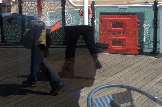 Passage of time is reflected from the ocean and the age of the mans reflection.