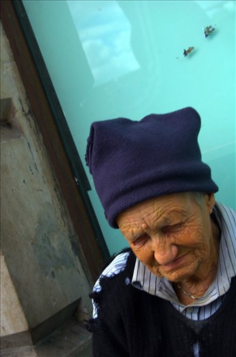 Homeless woman sits on the streets of London.