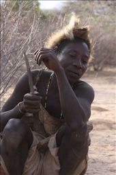 The tribesmen wait patiently to carve the Dik Dik on the fire.: by kgoussetis, Views[252]