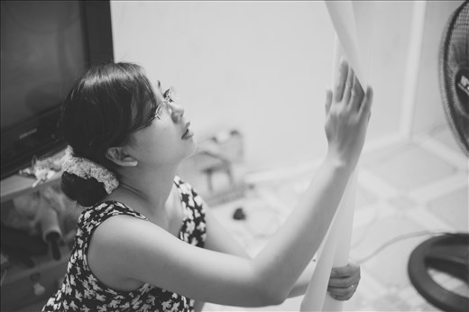 In this photo, my sister was preparing paper to draw a paint for her baby.