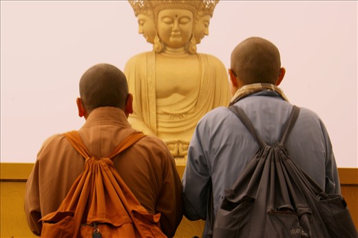 Praying monks in Sichuan at the top of the Emeishan mountain 