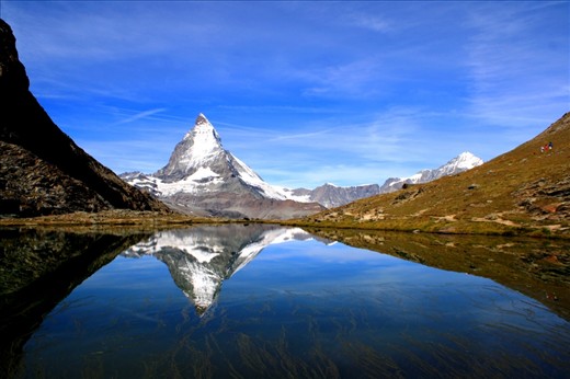 Matterhorn as relflected in a lake, July 13, 2011. To take this photo, I needed to stay and wait here for one hour till the wind has completely stopped. 