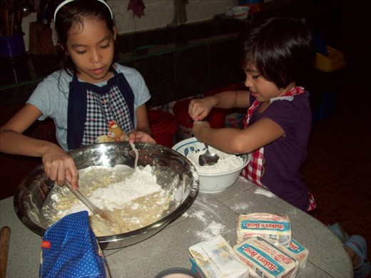 My daughter and niece baking with our Aunt Tj and the nuns