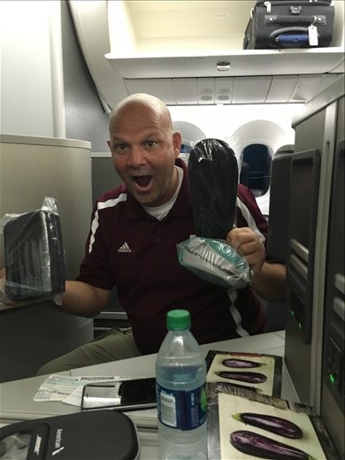 Kirk is so excited to get some swag from American Airlines in Business Class