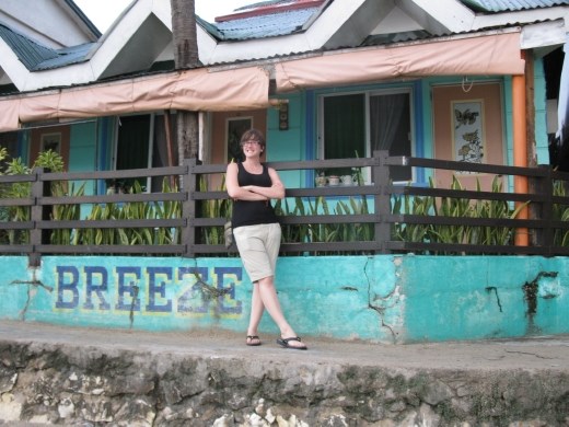 K in front of our cabin on beach
