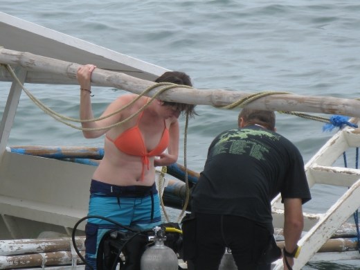 K preparing her equipment on boat