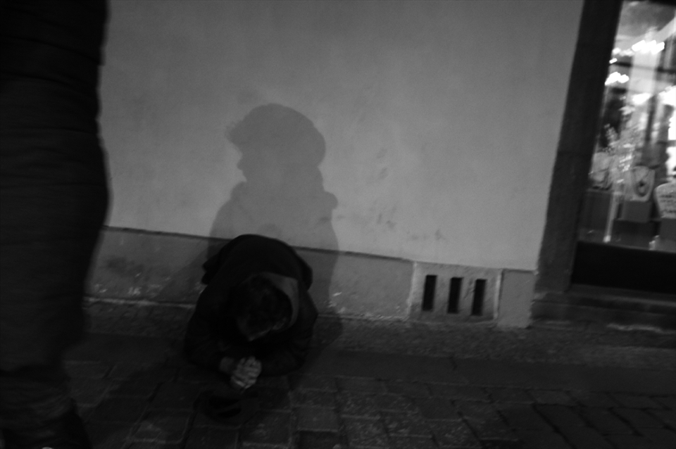 2nd picture about homeless people in Prague. I took it in Old town of Prague, and the homeless man was shadowed by a woman, i feel that rich people to bear hard upon poor people.