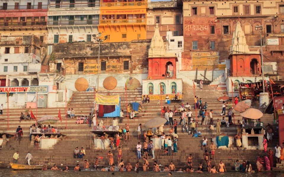 Pilgrims in the early morning at the bathing ghats of Varanasi. A place with a cacophony of sound smell and color.