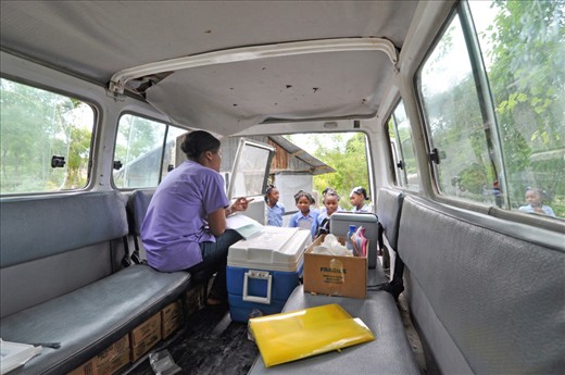Haiti is an incredibly mountainous country with comparably few roads to rural and remote areas, an element that makes access to health care difficult. To combat this problem, organizations use mobile clinics—cars packed full of supplies and medical professionals who travel to remote catchment areas to provide counsel, education and medicine, among other things. This photo shows just that: a community health nurse instructing school girls on how—and when—to take the vitamins they're receiving. 