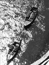 'Rabelos' the flat bottomed boats historically used for the transportation of port wine, sit quietly on the Douro River as echoes of traditions past.: by klopes, Views[578]