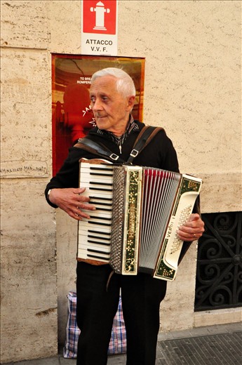 The old man plays the instrument for a living, worried about his daily living spending as well as for his family.