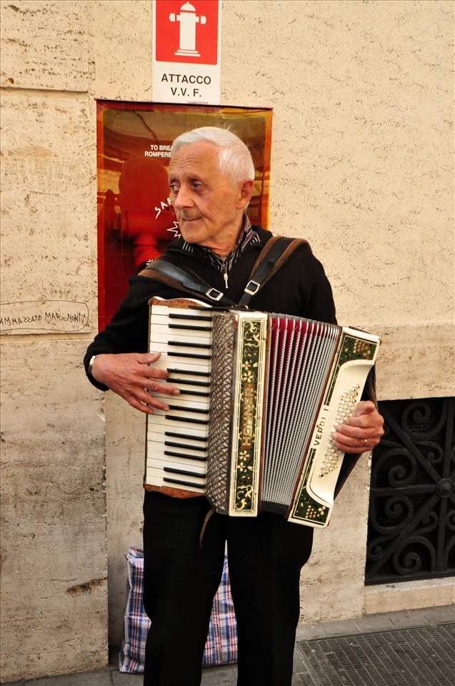 The old man plays the instrument for a living, worried about his daily living sp
