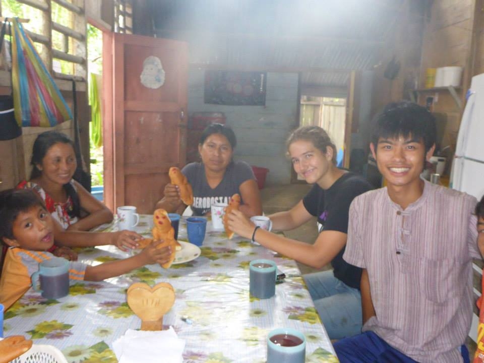 Preparing to eat Guagua de Pan and drink Colada Morada. 
