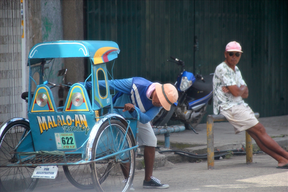 Tricycles are a means of transportation in small towns in the Philippines, Family Names are what they put at the back of the tricycles to be identified