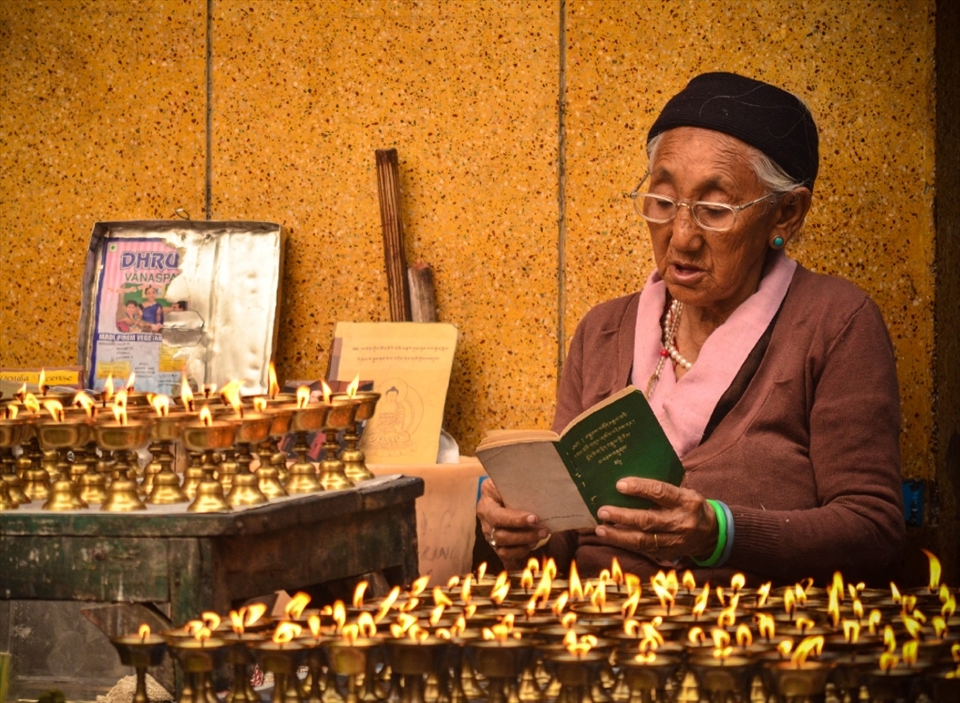 Faith is a state of being-A woman reads her morning prayers.