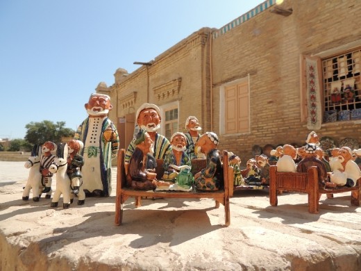 Khiva glazed souvenirs of men at dining table