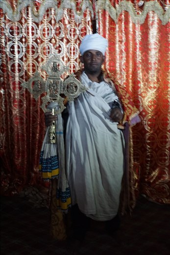 priest with Lalibela Cross