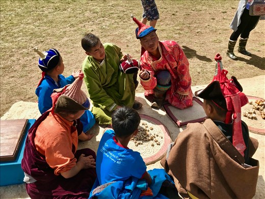 Playing knucklebones
