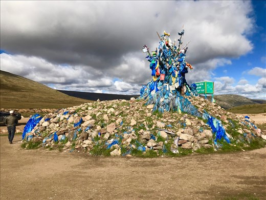 making a kora at the top of a pass in the hopes of a good and safe journey