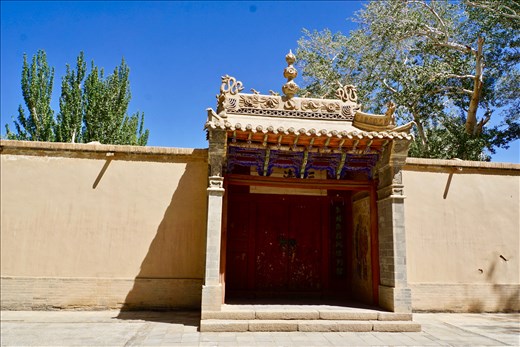 Taoist temple entrance in front of grottoes