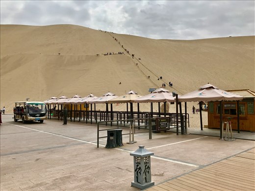 shuttle station with sledders in the background