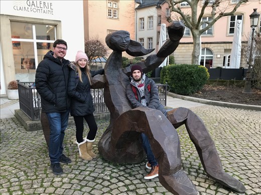 Modern wooden sculpture in front of Clairefontaine Gallery