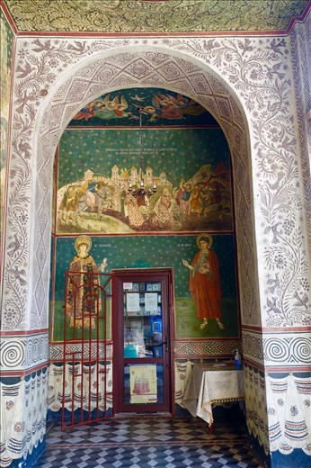 frescos by the entrance to the Cathedral