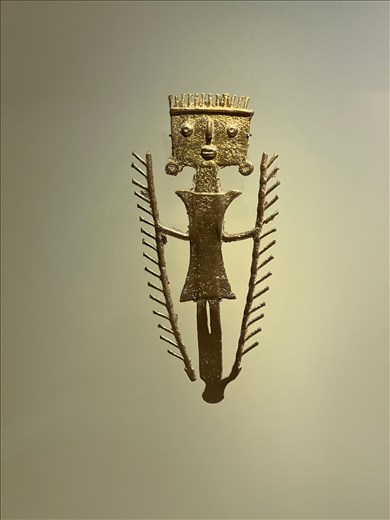 Shaman using palm leaves to create wind that calls the spirits, Museo del Oro