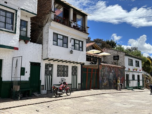 People taking photos in front of mural, Mongui