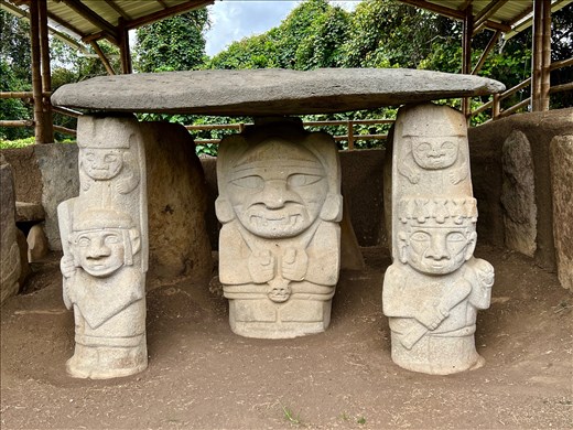 tomb guardians with main figure in the center, perhaps representing  the deceased. Sometimes their profession may be indicated by what they are holding. 