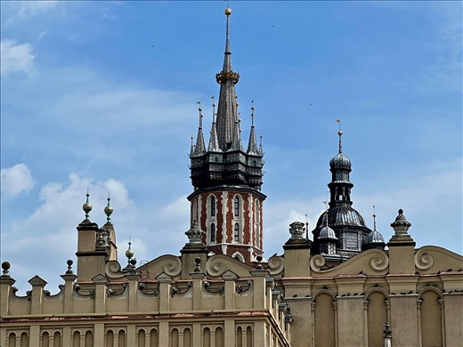 figures on the roof of Main Market with St. Mary's spires 
