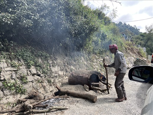 repairing the road the old way - the rains washed away a number of the curves on the mountain roads