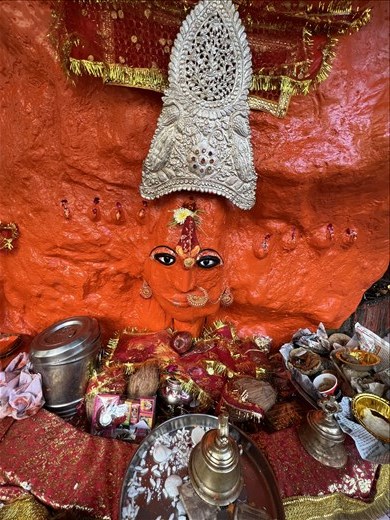 Devi in rock temple on the side of the lake