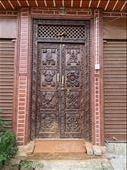 door with eight auspicious symbols in newly renovated house in Sankhu - the village was badly damaged in the 2015 earthquake: by krodin, Views[128]
