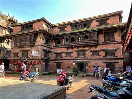 Monastery with founder as mannequin in the window, Bhaktapur
