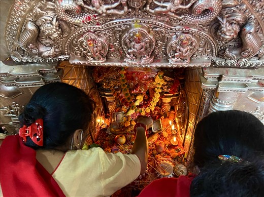 women worshipping at shrine in Banglamukhi Temple, Patan