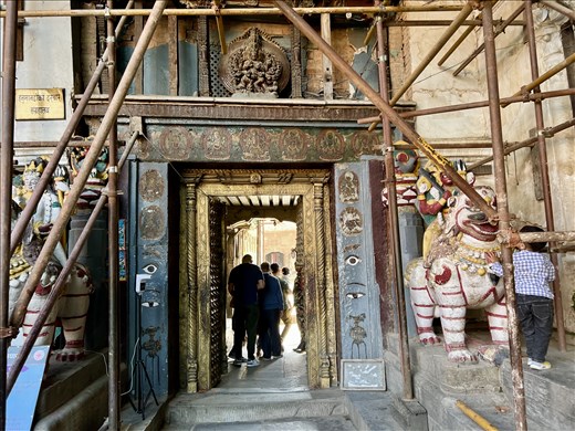 Museum entrance with little boy playing with guardian lion