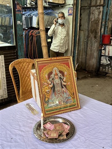 Durga photo shrine in the middle of the street in Shankari Bazar