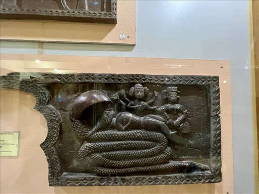 I think this 19th C piece is the Sleeping Vishnu on King Naga, but that is not what the sign says