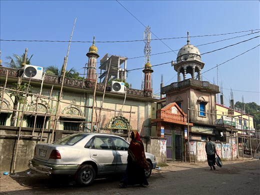 street scene with loudspeaker minaret by the boat dock