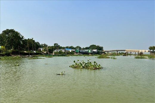 river scene with fishing nets drying on the bridge