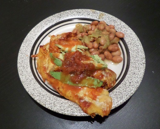 Bird's eye view of enchiladas on a plate.